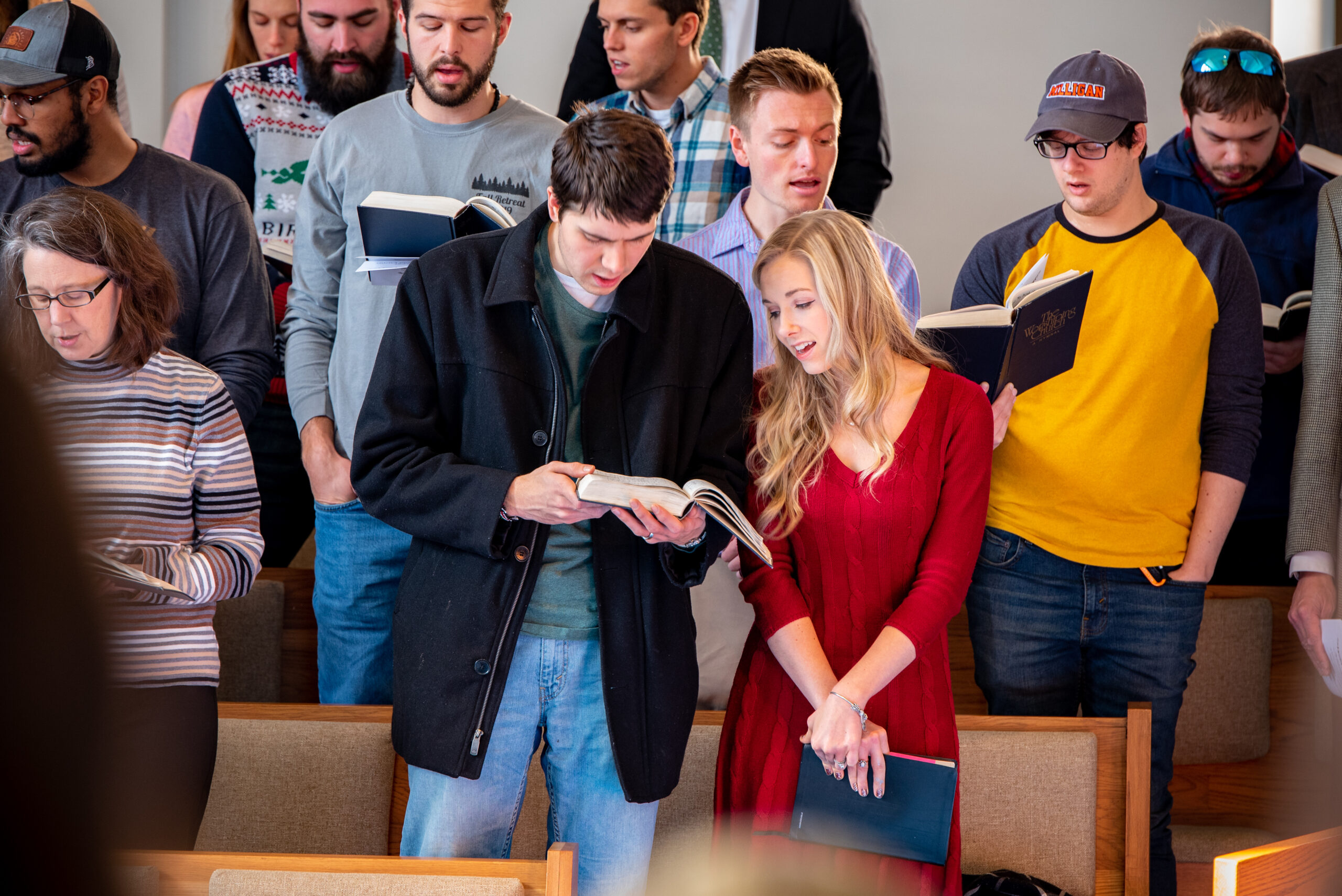 Students standing in a chapel service at Emmanuel